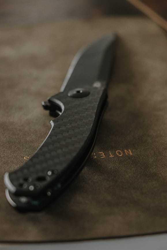 Black Folding Knife on Gray Surface right to bear insurance review